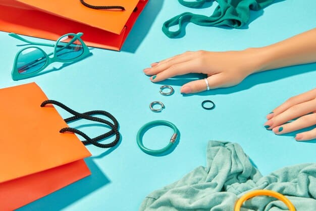 A close-up of a woman's hands holding a variety of pastel-colored clothing items. The items include a soft lavender sweater, a light mint green scarf, and a baby blue blouse. The background is a neutral grey, which makes the pastel colors pop. The lighting is soft and diffused, enhancing the gentle and calming effect of the colors.