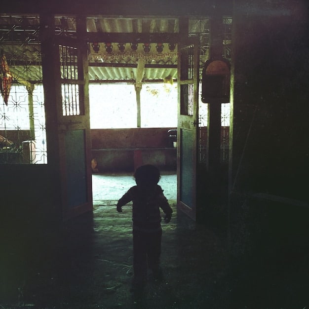 A suspenseful scene from a Japanese dorama, showcasing a tense moment between two characters, possibly related to a mystery or crime theme.