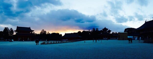 A panoramic shot of a pivotal scene in , set against a beautiful Korean landscape during the golden hour, highlighting the drama's visual appeal and production quality.