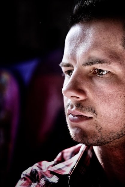 A close-up shot of one of the lead actors in , expressing a strong emotion such as sadness, determination, or love. Emphasize the actor's facial expressions and the emotional intensity of the scene.