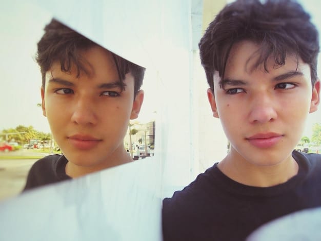 A split screen image showing the before and after of someone starting a new Korean drama series. On one side, the person looks bored and unoccupied. On the other side, the person is animated and happy while watching the K-drama, with a phone showing the cast, emphasizing the transformative power of an engaging K-drama series.