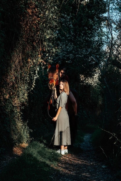 A close-up shot of two lovers embracing passionately in a moonlit garden. The woman is wearing a white lace dress, and the man is in a dark formal coat. The moonlight reflects on their faces, highlighting their intense emotions. Flowers and greenery surround them, creating a romantic and ethereal atmosphere.