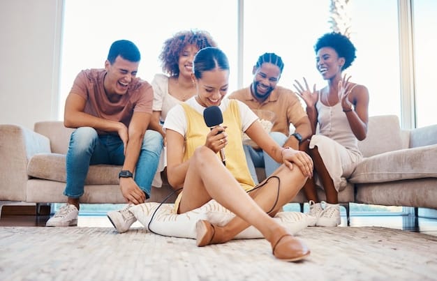 A group of young adults sitting on a couch, laughing and using their smartphones. The smartphones display different streaming apps, symbolizing shared subscriptions managed by an app.